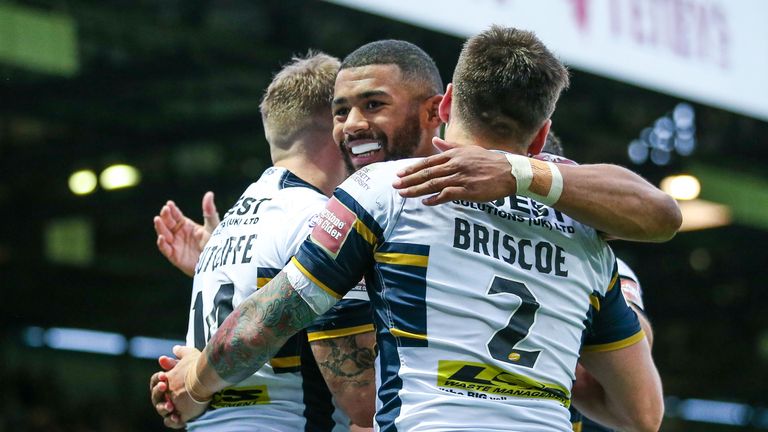 Leeds' Liam Sutcliffe celebrates his try with Kallum Watkins and Tom Briscoe