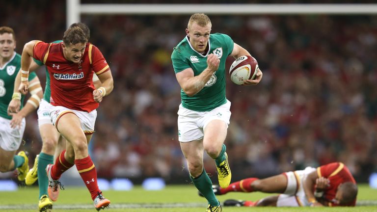 Keith Earls of Ireland breaks with the ball to score a try