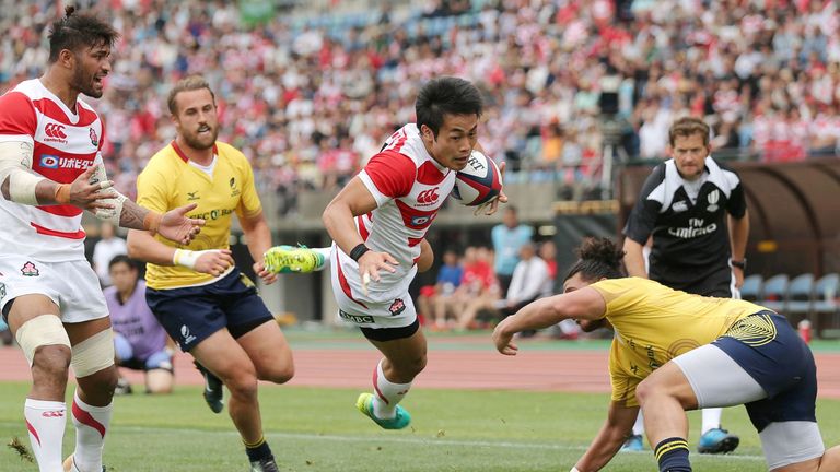 Kenki Fukuoka (C) of Japan jumps to score a try during a test match with Romania at Kumsmoyo Athletics Stadium in Kumamoto, western Japan 10.06.2017