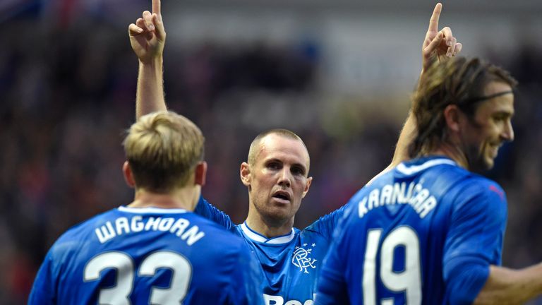 Rangers' Kenny Miller (centre) celebrates with his team-mates after firing them ahead