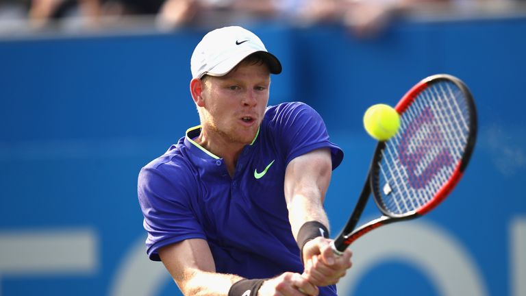 LONDON, ENGLAND - JUNE 19:  Kyle Edmund of Great Britain plays a backhand during the mens singles first round match against Denis Shapovalov of Canada duri
