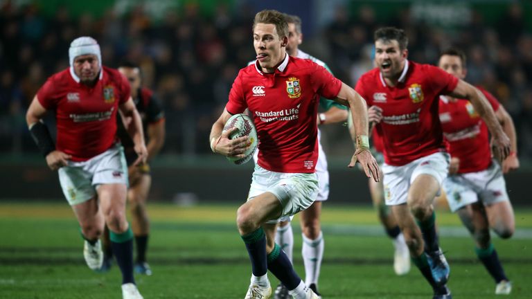 British and Irish Lions player Liam Williams (C) makes a break during the rugby union match between the British and Irish Lions and the Waikato Chiefs at F