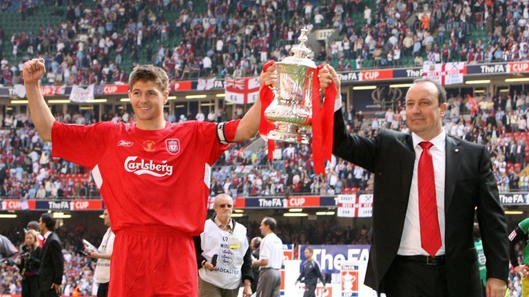 CARDIFF, United Kingdom:  Liverpool manager Raphael Benitez (R) and captain Steven Gerrard lift the FA Cup after Liverpool beat West Ham 3-1 on penalties