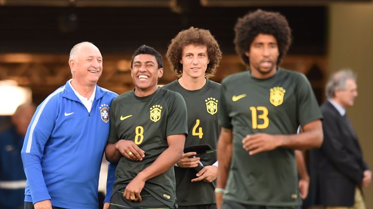 (FromL) Brazil's coach Luiz Felipe Scolari, Brazil's midfielder Paulinho