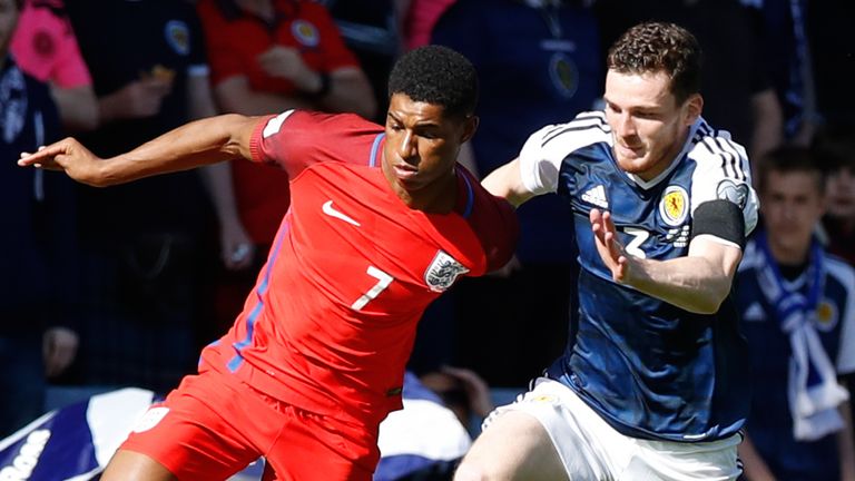 England's Marcus Rashford (left) and Scotland's Andrew Robertson battle for the ball during the 2018 FIFA World Cup qualifying, Group F match at Hampden