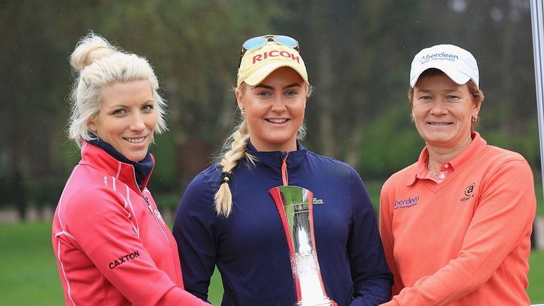 Mel Reid of England, Charley Hull and Catriona Mtthew of Scotland hold the trophy during the Ricoh Women's British Open Media Day