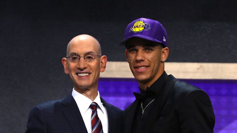 Lonzo Ball walks on stage with NBA commissioner Adam Silver after being drafted second overall by the Los Angeles Lakers