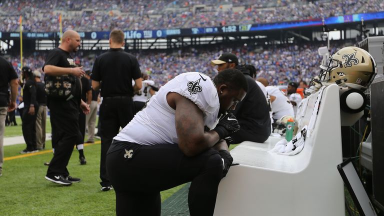 Nick Fairley #90 of the New Orleans Saints takes a knee before playing against the New York Giants