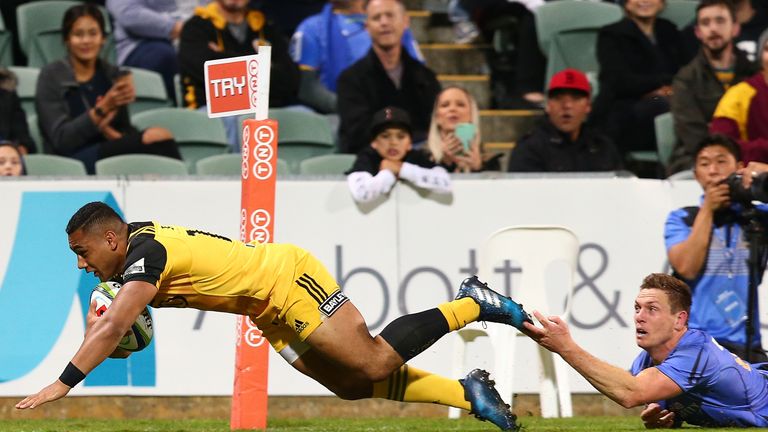 Ngani Laumape of the Hurricanes crosses for a try 