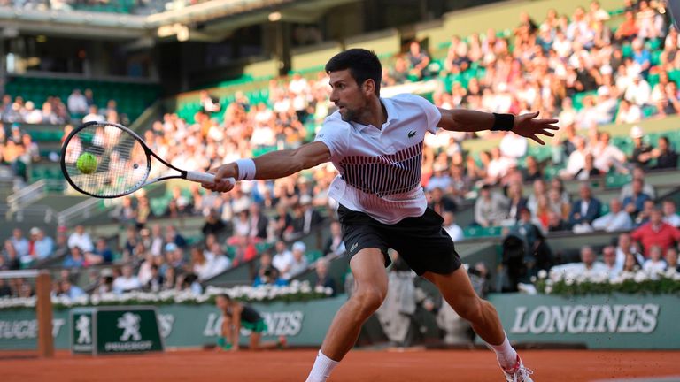 Novak Djokovic returns the ball to Albert Ramos-Vinolas at French Open