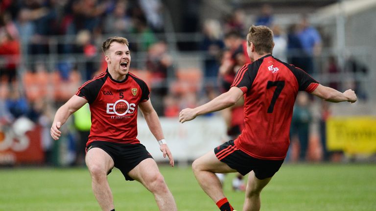 O'Hanlon and Caolan Mooney of Down celebrate after the final whistle 