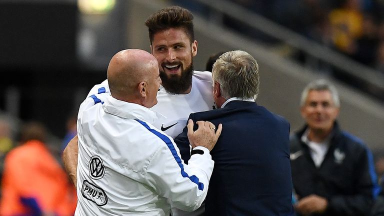Oliver Giroud celebrates with France boss Didier Deschamps after his goal against Sweden
