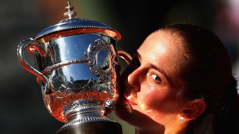 PARIS, FRANCE - JUNE 10:  Jelena Ostapenko of Latvia celebrates victory by kissing the trophy following the ladies singles final match against Simona Halep