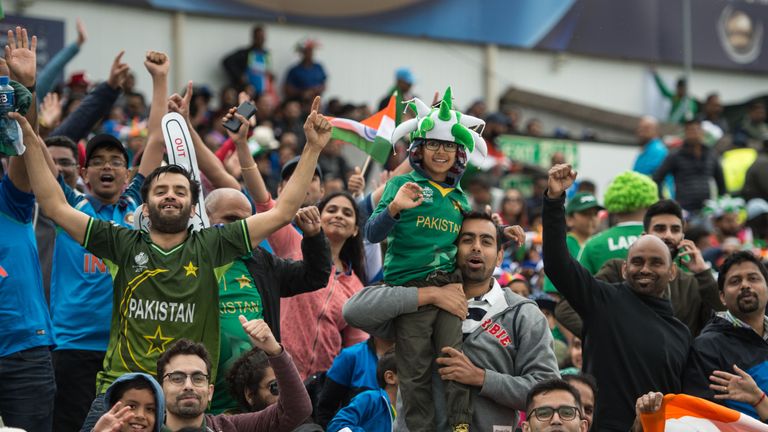 Pakistan fans cheer and wave national flags during the ICC Champions trophy match between India and Pakistan at Edgbaston