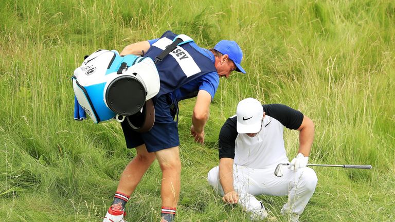 HARTFORD, WI - JUNE 16:  Paul Casey of England and caddie John McLaren search for his ball on the 14th hole during the second round of the 2017 U.S. Open a