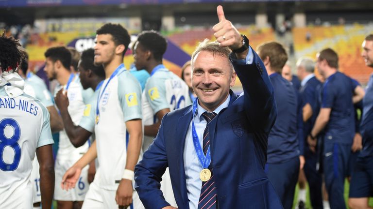 England's coach Paul Simpson celebrates winning the U-20 World Cup final football match between England and Venezuela in Suwon on June 11, 2017.  / AFP PHO