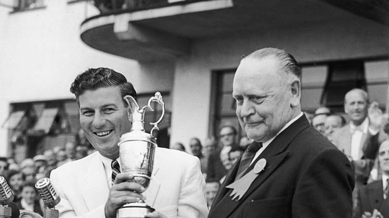 Australian golfer Peter Thomson receives the Open Golf Championship cup from S. T. L. Greer, Captain of the Royal Birkdale Golf Club at Southport, 10th Jul