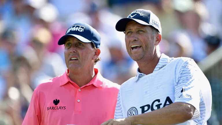 SPRINGFIELD, NJ - JULY 28:  Phil Mickelson of the United States talks with caddie Jim 'Bones' Mackay on the 13th tee during the first round of the 2016 PGA