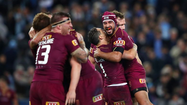 Johnathan Thurston celebrates with team-mates after Queensland won game two of the State Of Origin series