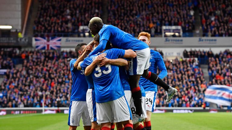 Rangers' Kenny Miller celebrates with his team-mates after firing them