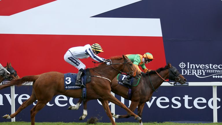 Reputation (right) wins the Investec Asset Management Handicap from Naggers