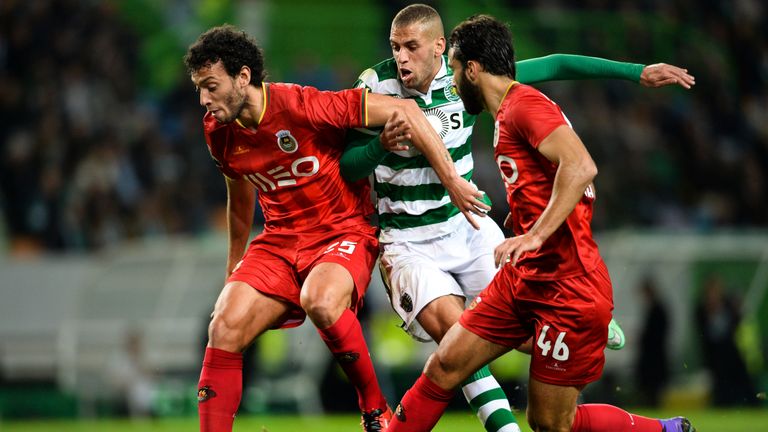 Sporting's Algerian forward Islam Slimani (C) vies with Rio Ave's defender Roderick Miranda (L) and Rio Ave's Brazilian defender Marcelo Ferreira