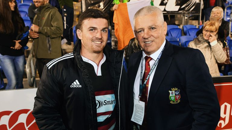 Bryn Gatland with his father Warren after the Lions' win over the NZ Barbarians