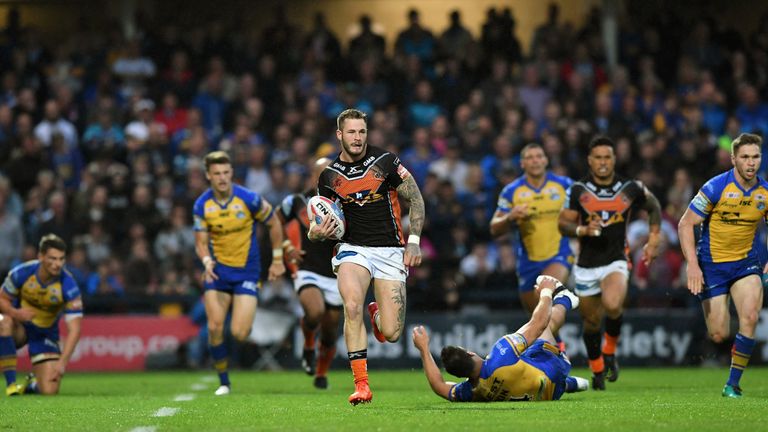 Zak Hardaker breaks to score a try against Leeds