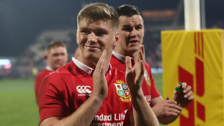 Owen Farrell and Jonny Sexton applaud the fans after the Lions' win over the Crusaders