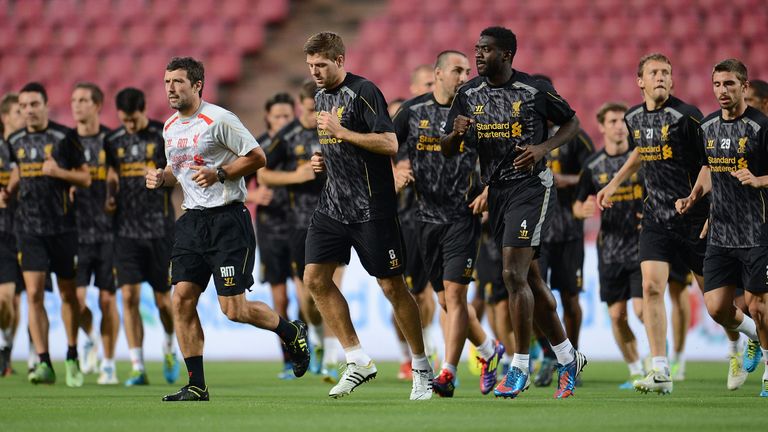 BANGKOK, THAILAND - JULY 27:  (L to R) Head of Fitness and Conditioning Ryland Morgans, Steven Gerrard and Kolo Toure lead team-mates as they jog during a 