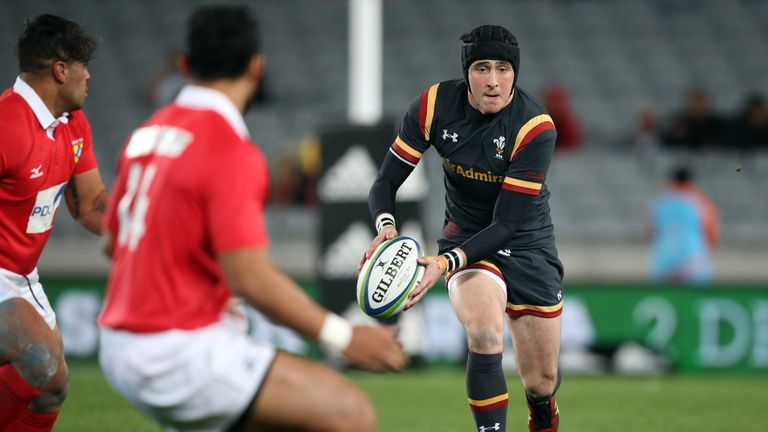 Sam Davies of Wales runs the ball against Tonga