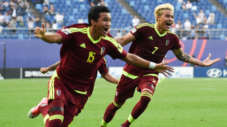Venezuela's forward Samuel Sosa (L) and forward Adalberto Penaranda Maestre (R) celebrate a goal during the U-20 World Cup semi-final football match betwee