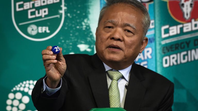 CEO of Carabao Group Sathien Setthasit draws a number during the first draw for the upcoming season's EFL Cup football tournament at Tawandaeng brewery in 