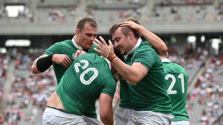 Sean Reidy  (20) is congratulated after scoring Ireland's fifth try