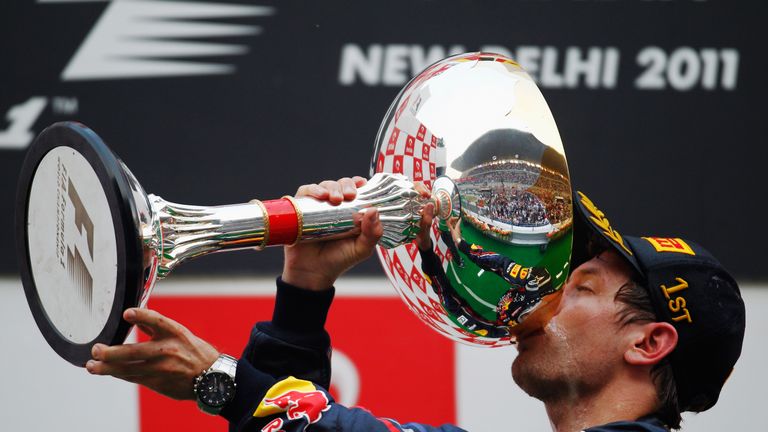 NOIDA, INDIA - OCTOBER 30:  Sebastian Vettel of Germany and Red Bull Racing celebrates on the podium after winning the Indian Formula One Grand Prix at the