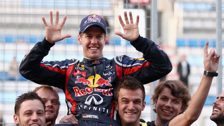 YEONGAM-GUN, SOUTH KOREA - OCTOBER 16:  Sebastian Vettel of Germany and Red Bull Racing celebrates with team mates as they win the Constructors title follo