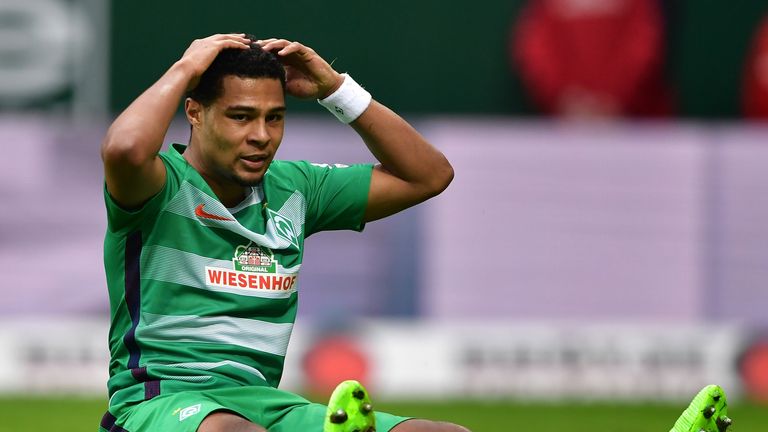 of Bremen is challenged by of Darmstadt during the Bundesliga match between Werder Bremen and SV Darmstadt 98