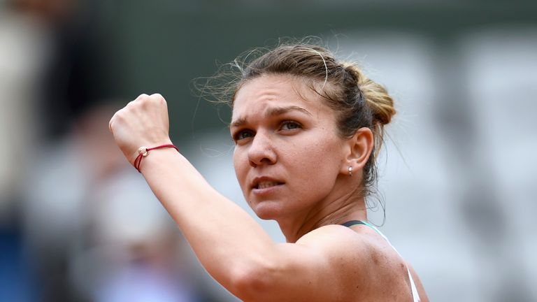 Romania's Simona Halep celebrates after winning her tennis match against Russia's Darya Kasatkina during their tennis match at the Roland Garros 2017 Frenc