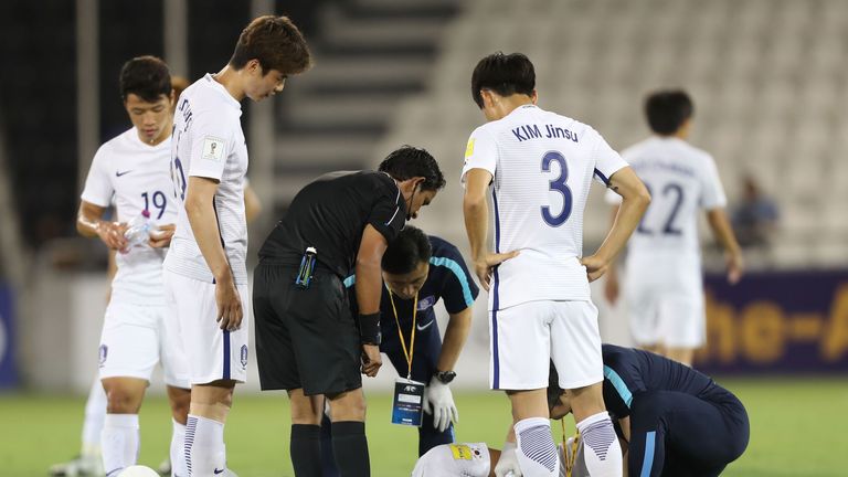South Korea's Son Heung-min receives medical treatment during the World Cup 2018 Asia qualifying football match between Qatar and South Korea at the Jassim