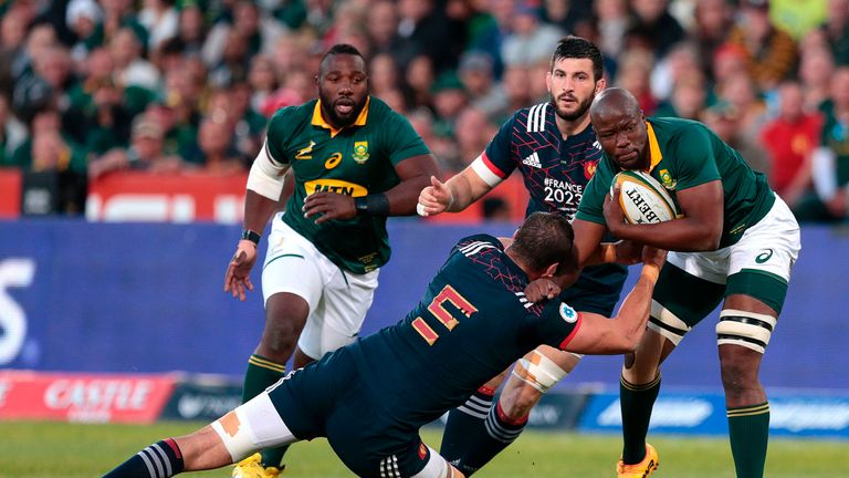 South Africa's Oupa Mohoje is tackled by France's Yoann Maestri (C)  during the first rugby union Test match between South Africa and France at the Loftus 