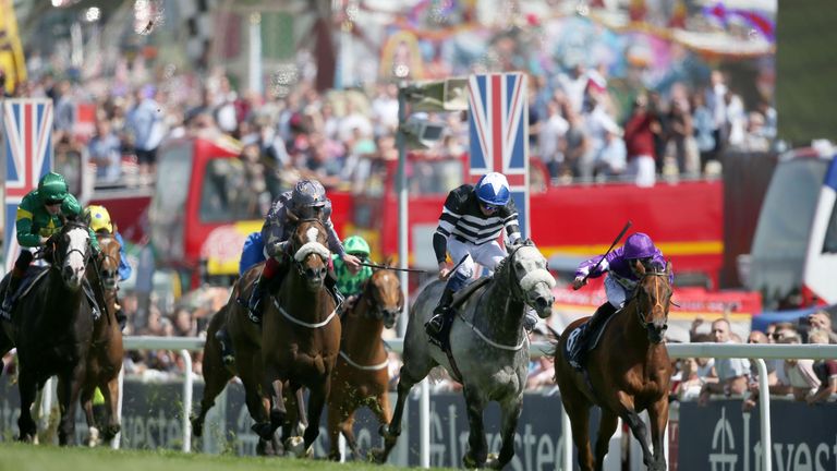 Sovereign Debt ridden by Jockey James Sullivan (centre) wins the Investec Diomed Stakes on Derby Day 2017