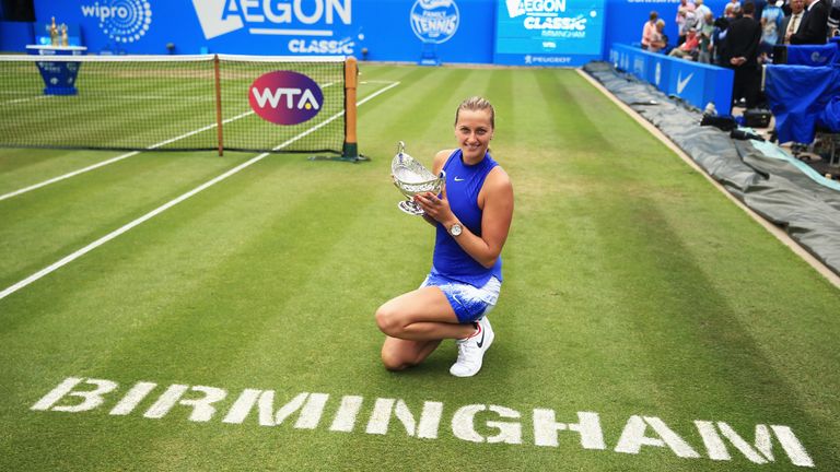 Petra Kvitova of the Czech Republic poses with the trophy after the Women's Singles final match against Ashleigh Barty