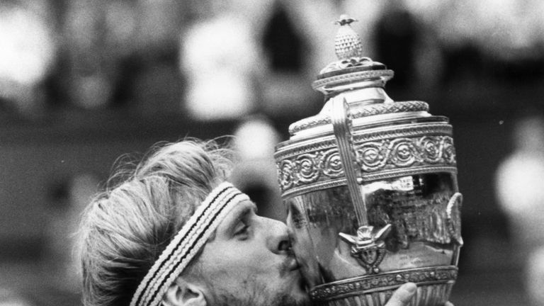 Bjorn Borg of Sweden kisses the men's singles trophy after winning it for the fifth time at the Wimbledon Tennis Championships