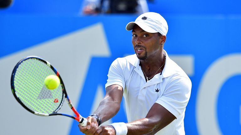 Donald Young of the US returns during his men's singles 1st round match against Australia's Nick Kyrgios at the ATP Aegon Championships tennis tournament