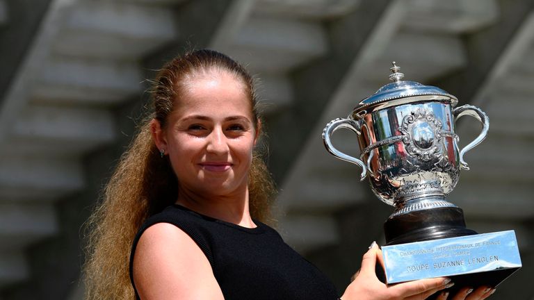 Latvia's Jelena Ostapenko poses on June 11, 2017 with her trophy after winning her final tennis match against Romania's Simona Halep