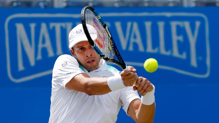Luxembourg's Gilles Muller hits a shot against US player Sam Querrey during their men's singles quarter-final tennis match at the ATP Aegon Championships