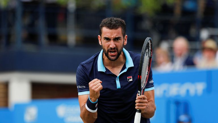 Croatia's Marin Cilic celebrates winning a game to go 3-2 up in the second set against Spain's Feliciano Lopez during the men's singles final