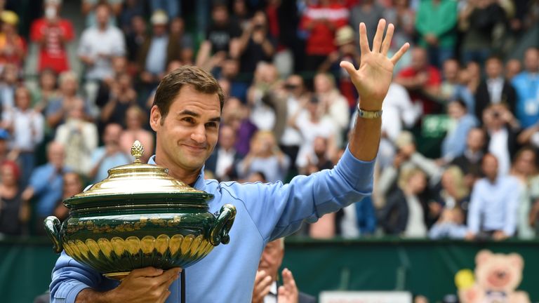 Roger Federer from Switzerland poses with his trophy after winning his final match against Alexander Zverev from Germany