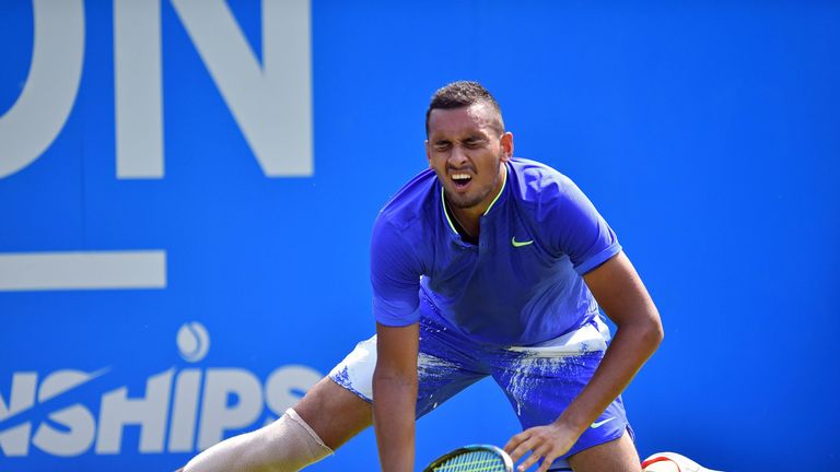 Australia's Nick Kyrgios went down awkwardly in the first set against Donald Young and was forced to retire