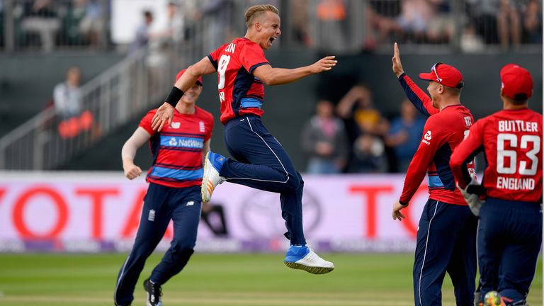 Tom Curran celebrates after taking his first international wicket for England.